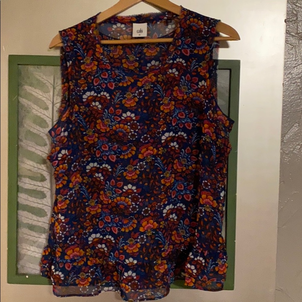 Blue sleeveless cabbie blouse with floral pattern